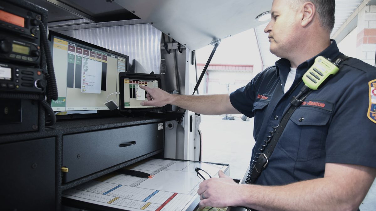 A fire officer working at a mobile incident command station